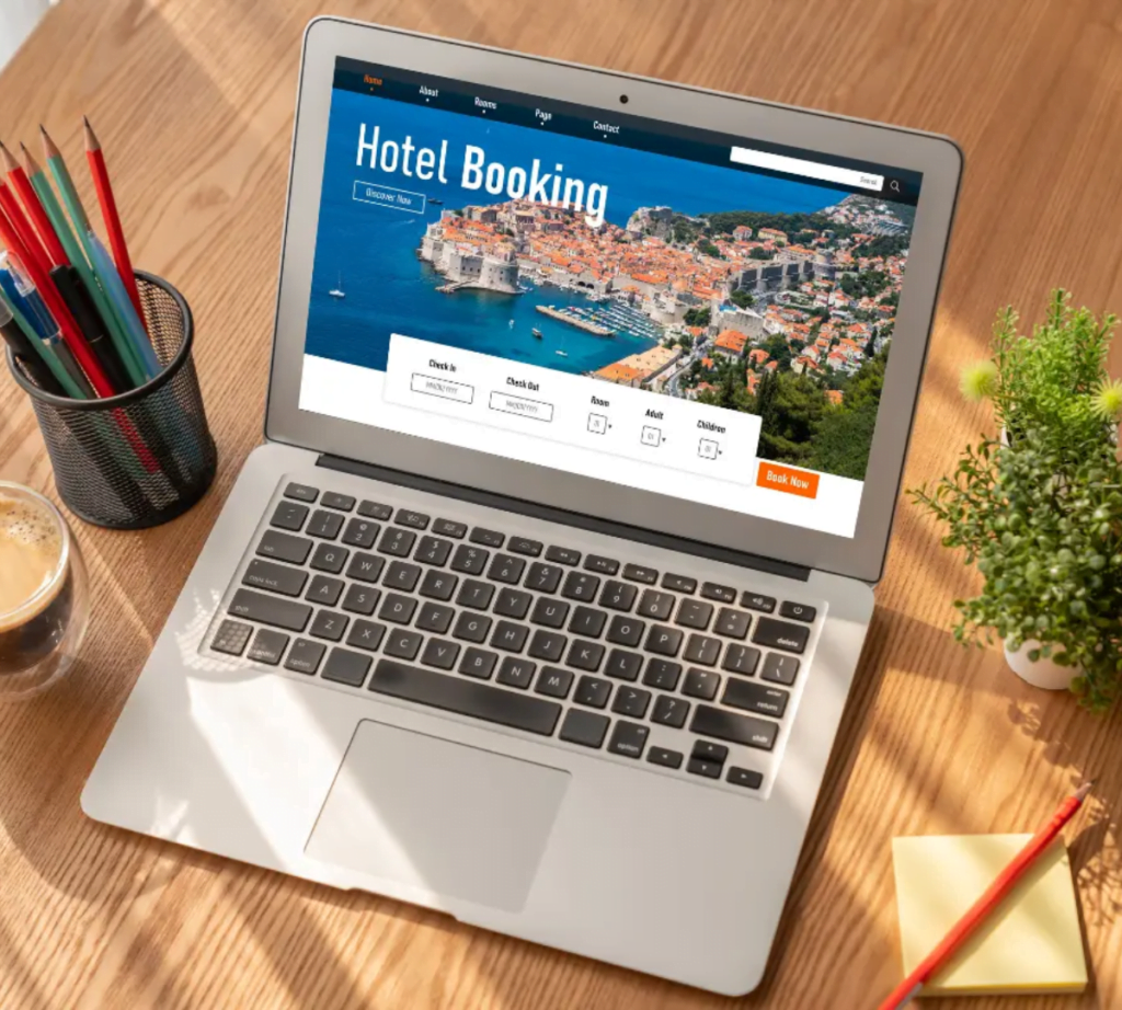A laptop in a table - Arise Hotel Marketing